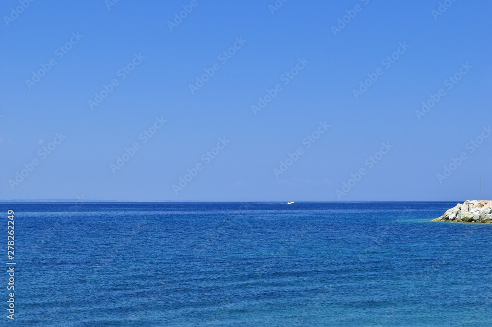 Serene blue sea on a sunny day in summer