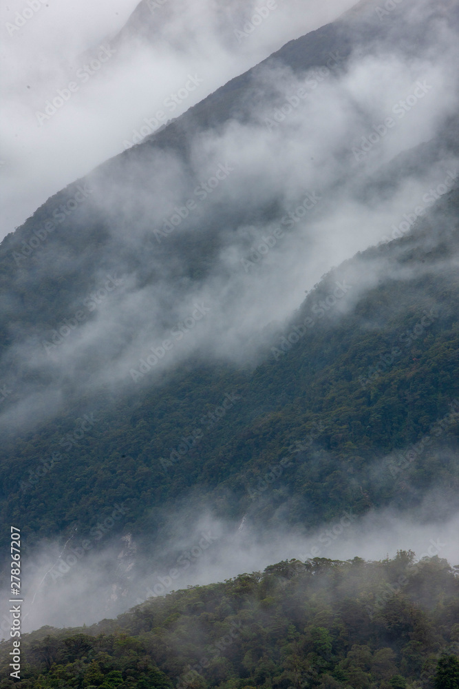 Mountains Queenstown New Zealand. Clouds fog