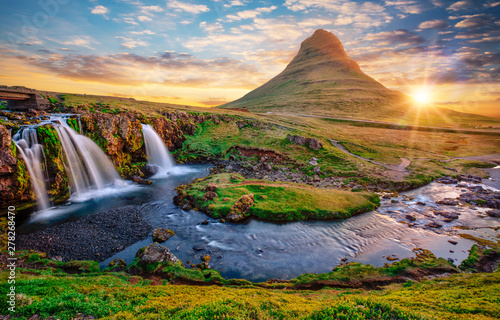 Fototapeta Naklejka Na Ścianę i Meble -  Beautiful landscape with sunrise on Kirkjufellsfoss waterfall and Kirkjufell mountain, Iceland, Europe.