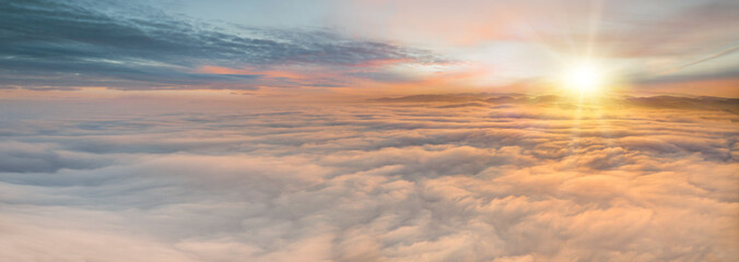 Sunset sky with beautiful clouds from the airplane window