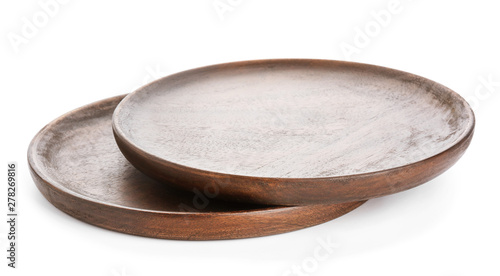 Wooden plates on white background
