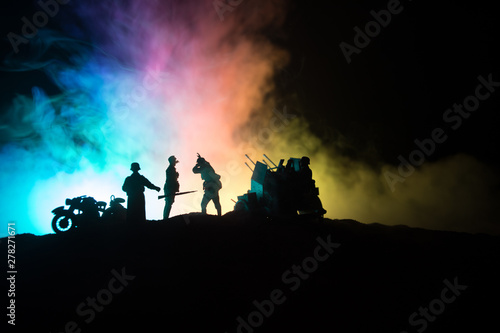 War Concept. Military silhouettes fighting scene on war fog sky background, © zef art