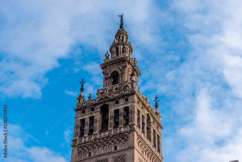 The Giralda is a bell tower of Seville Cathedral in Spain. It was built as the minaret for the Great Mosque of the Sevilla in Al-Andalus, Moorish Spain during the reign of the Almohad dynasty.