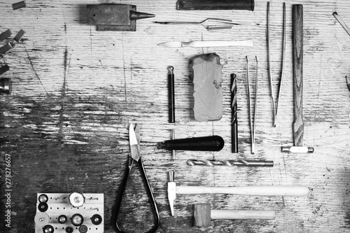 Tools of jewellery. Jewelry workplace on leather background with copy space for text. Top view. photo