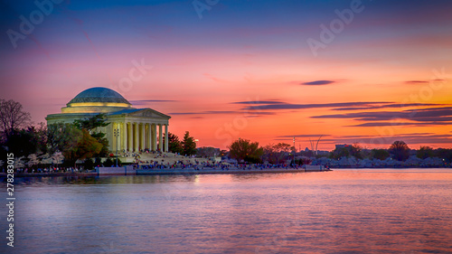 Jefferson Memorial at sunset during peak cherry blossom time photo