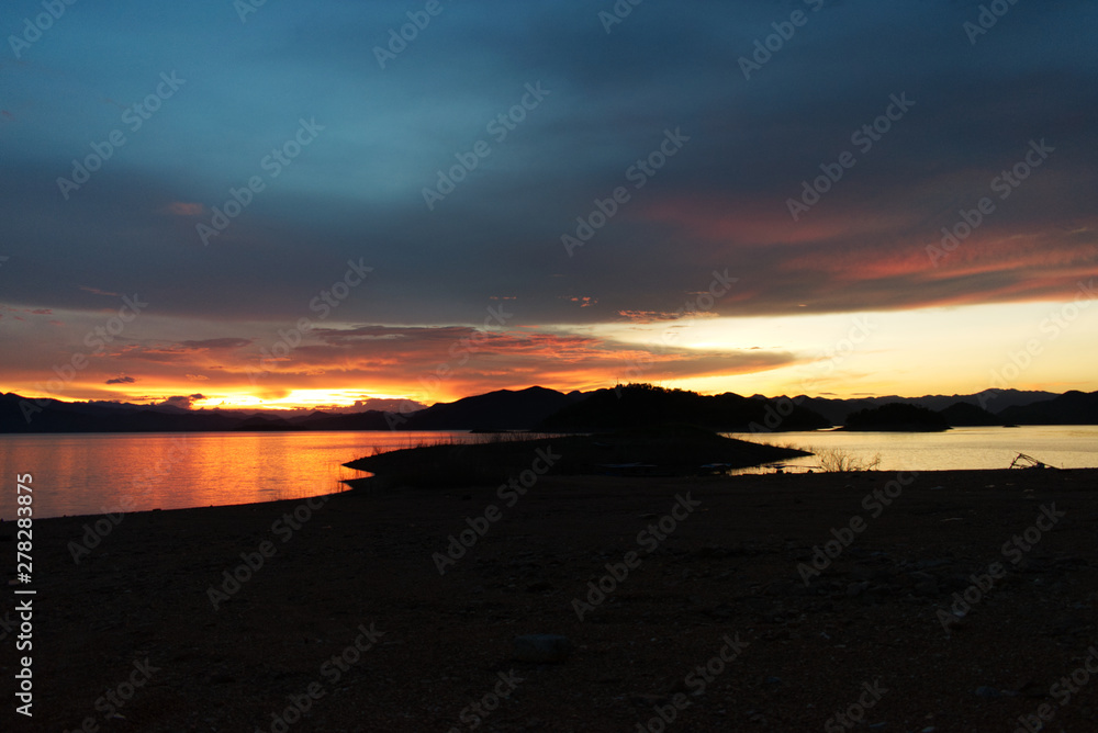 View of evening sky at sunset over the lake, Kang Krajarn National Park, Petchburi, Thailand