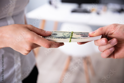 Human's Hand Exchanging The Money