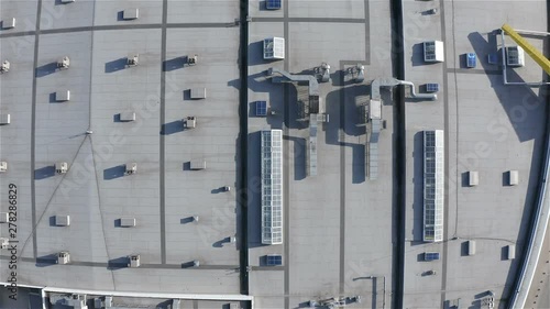 aerial survey of the roof of an industrial building with light tunnel structures.