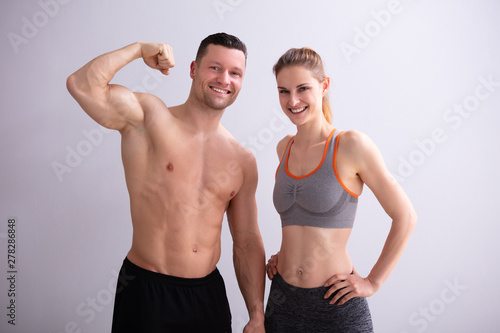 Couple Showing Muscles © Andrey Popov