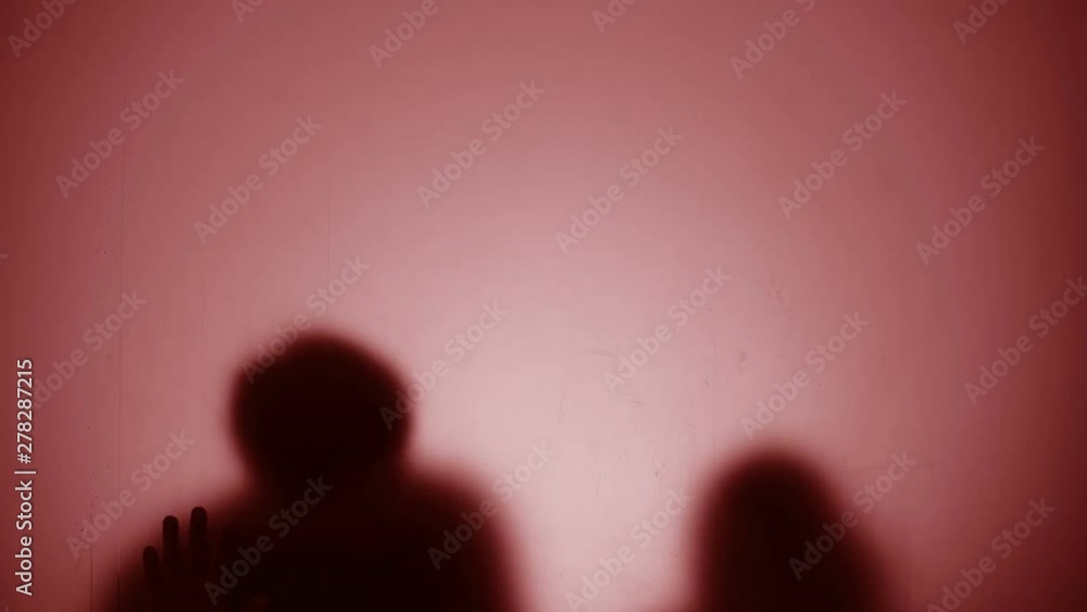 Silhouettes of people sliding on glass, dying from warfare, red light blinking