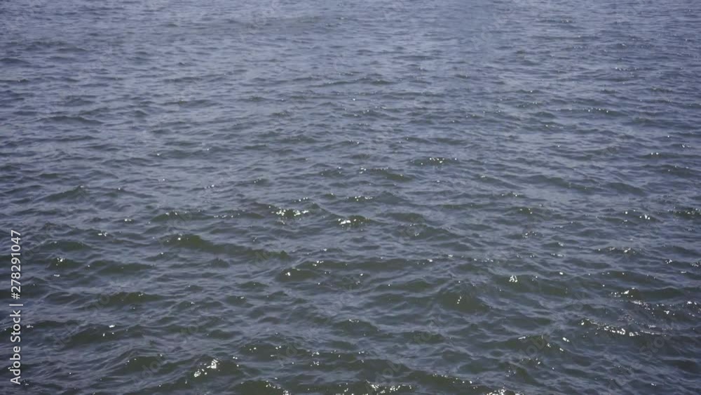 Hong Kong Harbour - Surface of the sea on a blustery day at noon. Hong Kong Harbour - Surface of the sea on a blustery day at noon.