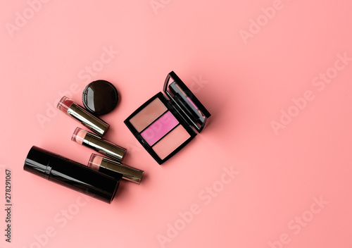  Set of Professional Cosmetic: Lipstics,make up shade or Illuminate Cheeks on a Pink Background. Top View. Copy Space for text