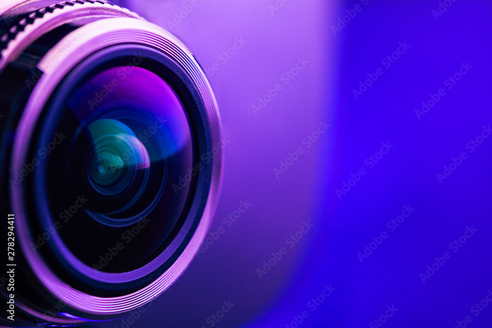 Camera lens with purple backlight. Side view of the lens of camera on  purple background. Purple camera Lens close Up. Stock Photo | Adobe Stock