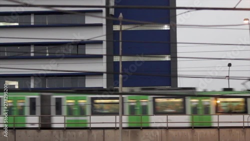 a train passing by the street photo