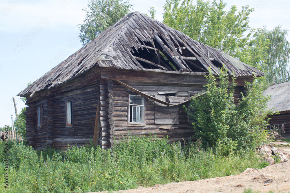 old abandoned wooden houses in Russian village view in summer old abandoned wooden houses in Russian village view in summer