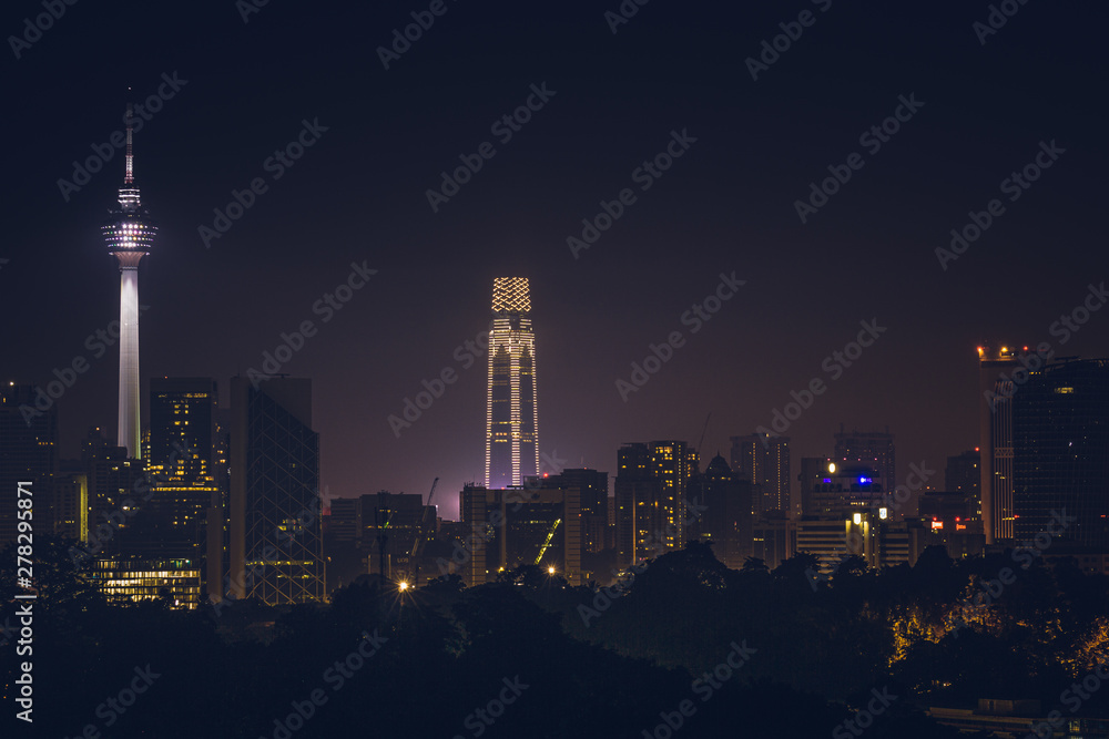 Sunrise view over downtown Kuala Lumpur with KL Tower and The Exchange 106 illuminated the town.