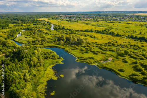 bird s-eye view of the bends of the river meadows and fields