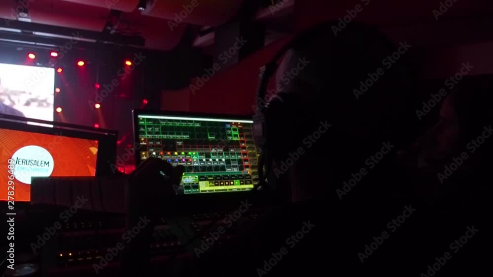Working with lighting console. Show lights. Adjust, change and control ...