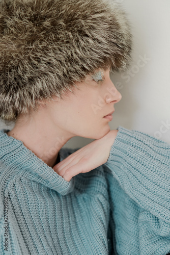 Portrait of a female model in blue sweater