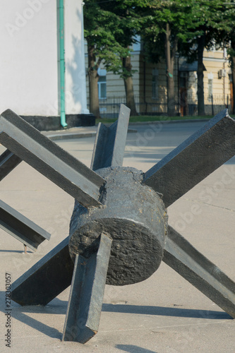 The street is blocked by anti-tank fences. The concept of war and confrontation. vertical photo. close up photo