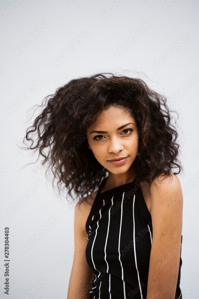 © Jack Sorokin Photography/Stocksy - Portrait of Young Mix Race Woman