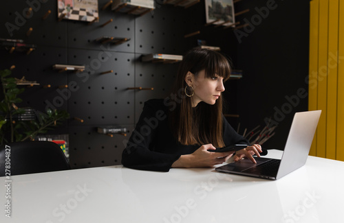 Young woman taking notes photo