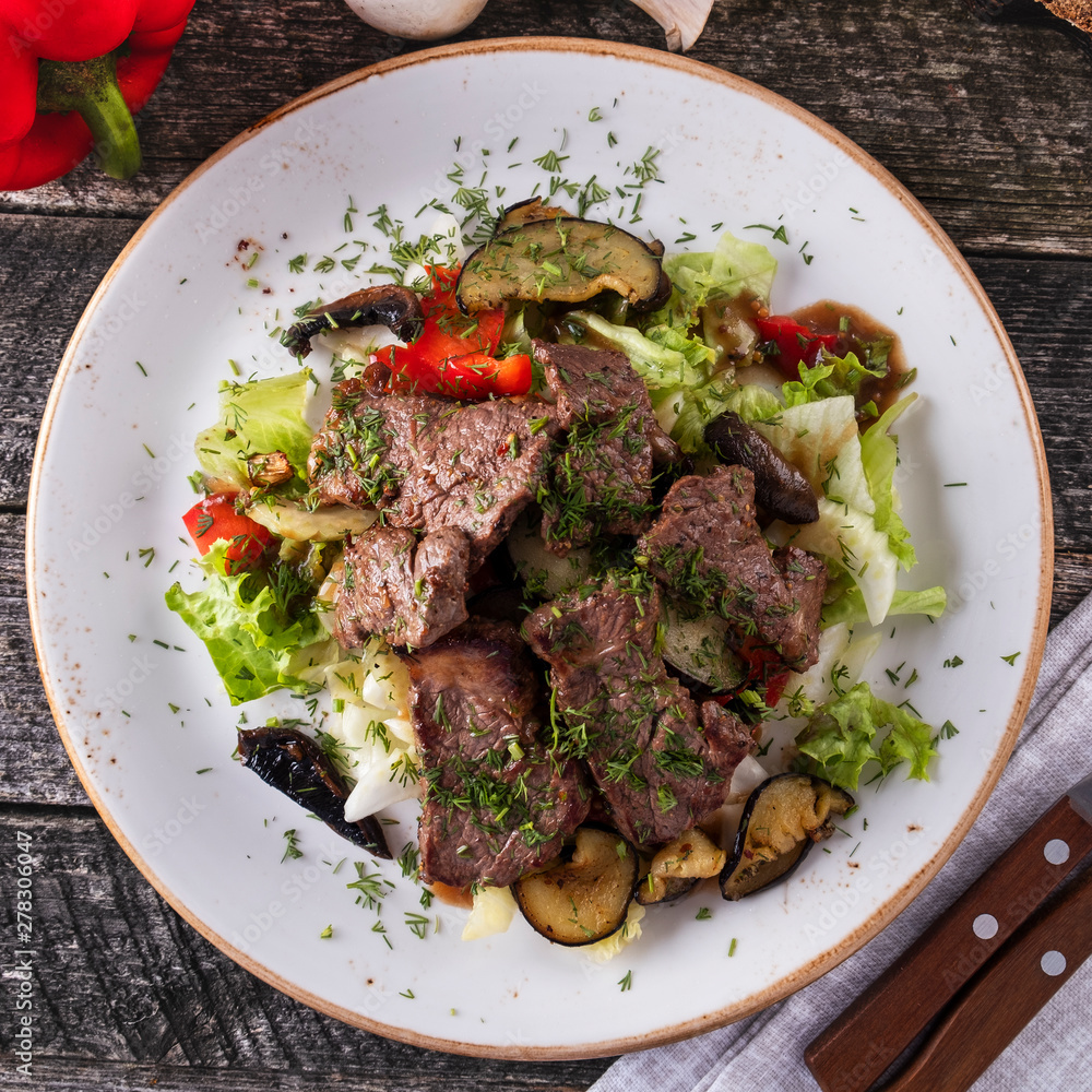 Meat salad with fresh vegetables. Top view. Closeup