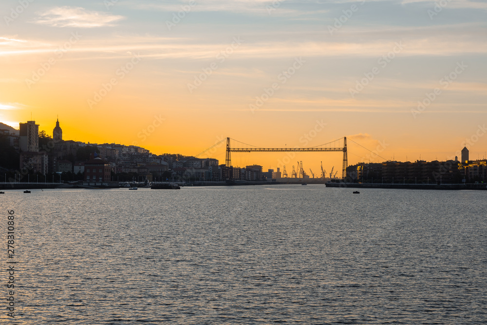 Panorama of Portugalete and Getxo with Hanging Bridge of Bizkaia at sunset from La Benedicta pier, Basque Country, Spain