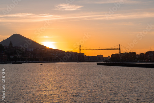 Panorama of Portugalete and Getxo with Hanging Bridge of Bizkaia at sunset from La Benedicta pier, Basque Country, Spain © Noradoa