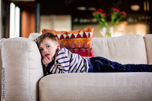Child watching TV in a transfixed state photo