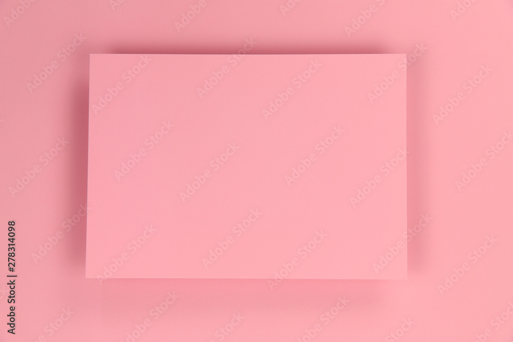 Pink paper texture background with frame in the center. Blank, photo, horizontal, free space in the center. Design and holidays concept