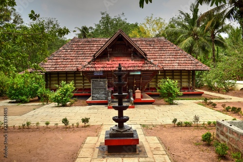 An old Kerala traditional temple with a beautiful stone lamp © renu31