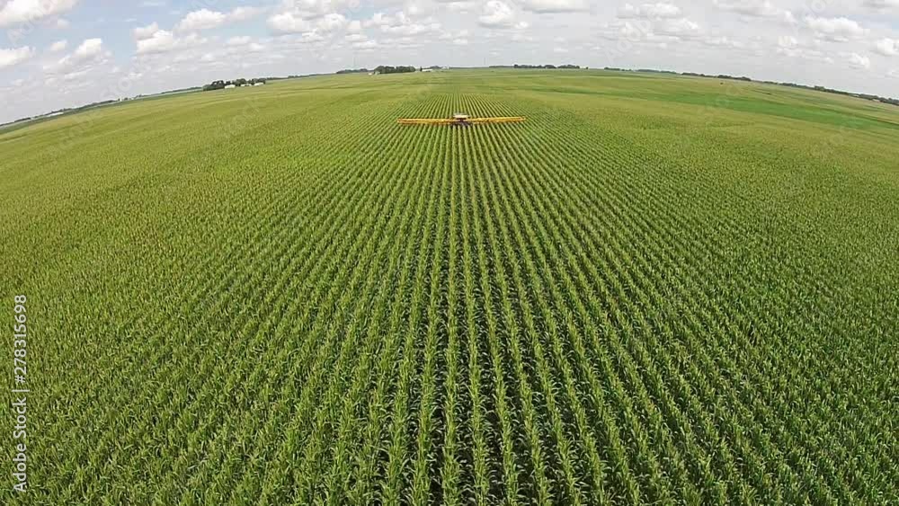 Aerial, harvester on farmland Aerial, harvester on farmland