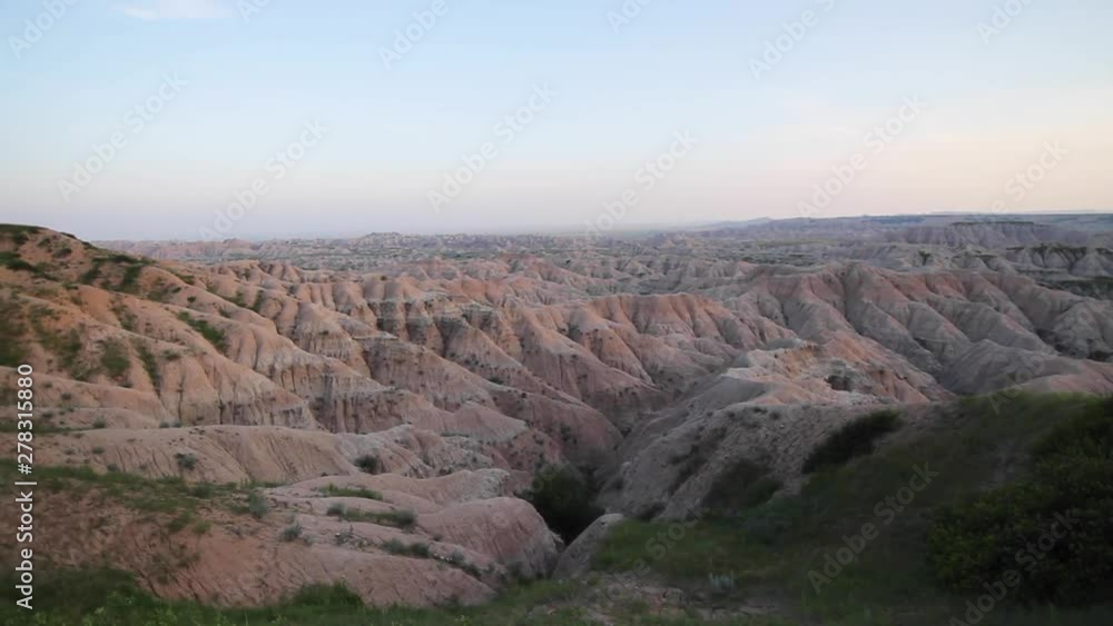 Pan left, rolling hill landscape at sunset Pan left, rolling hill landscape at sunset
