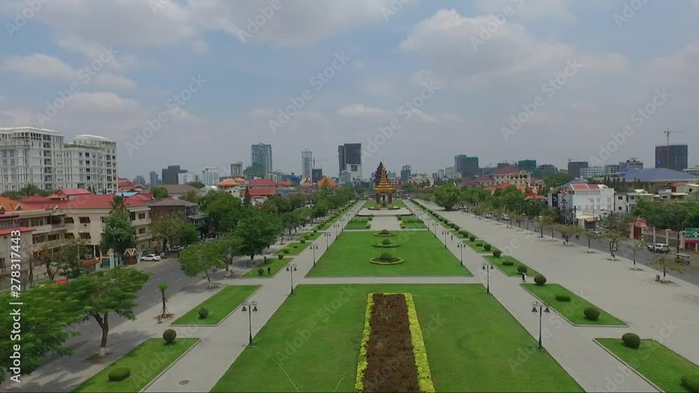 Panoramic view of Independence park in the middle of King Sihanouk boulevard, with King father Norodom monument and Independence monument, Phnom Penh, Cambodia Panoramic view of Independence park in the middle of King Sihanouk boulevard, with King father Norodom monument and Independence monument, Phnom Penh, Cambodia