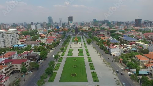 Panoramic view of Independence park in the middle of King Sihanouk boulevard, with King father Norodom monument and Independence monument, Phnom Penh, Cambodia photo