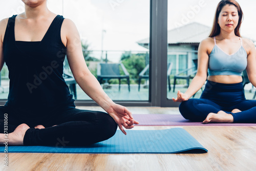 Young woman doing sitting meditation yoga