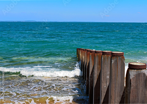 wooden breakwater in the sea
