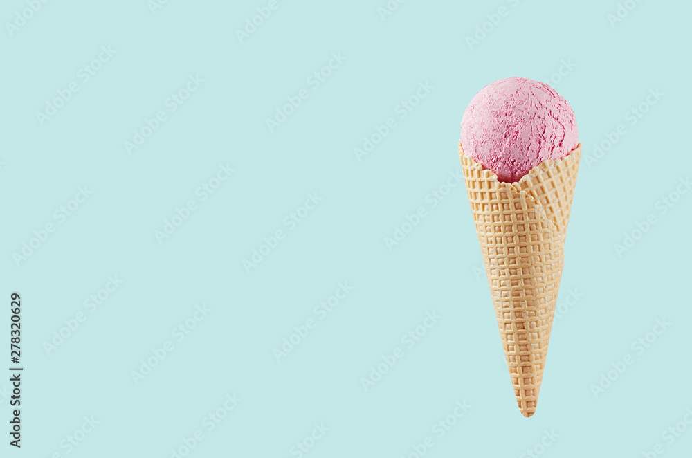 Strawberry ice cream in crisp waffle cone on pastel green background, mock up for design, summer food. Strawberry ice cream in crisp waffle cone on pastel green background, mock up for design, summer food.
