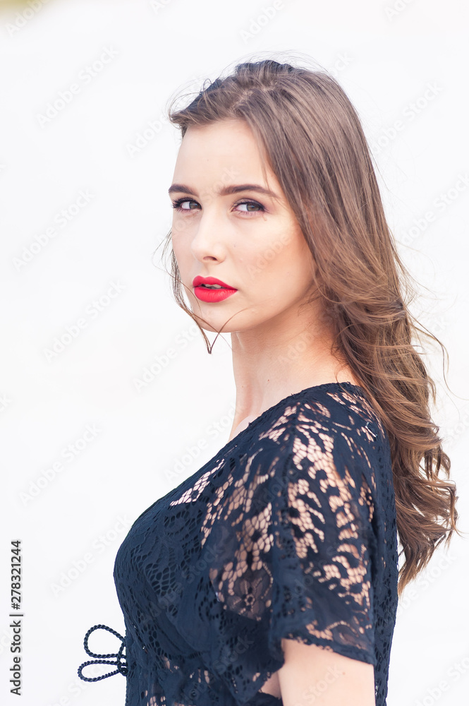 Beautiful young woman posing on the desert sand dune Beautiful young woman posing on the desert sand dune