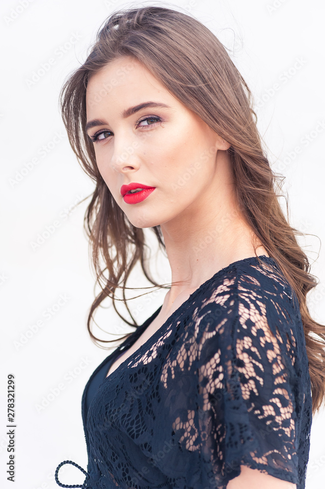 Beautiful young woman posing on the desert sand dune Beautiful young woman posing on the desert sand dune