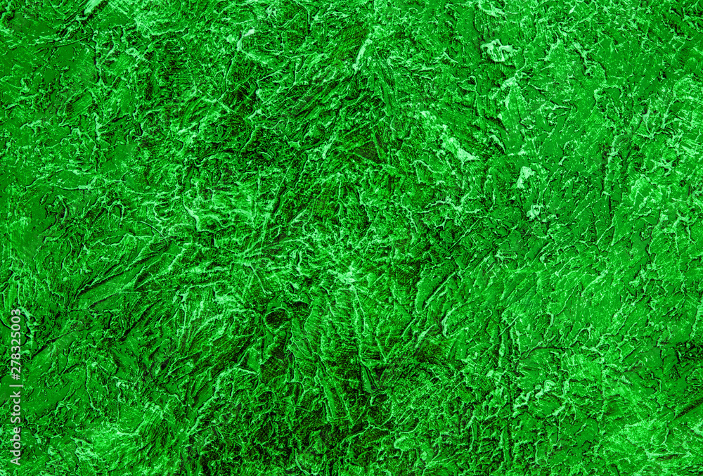 The texture of the plaster on the wall is painted in a green color. Background. The texture of the plaster on the wall is painted in a green color. Background.