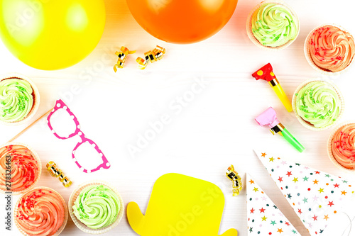 Colorful birthday party accessories on white. Wrapped gifts, confetti, balloons, party hats, decorations, copy space