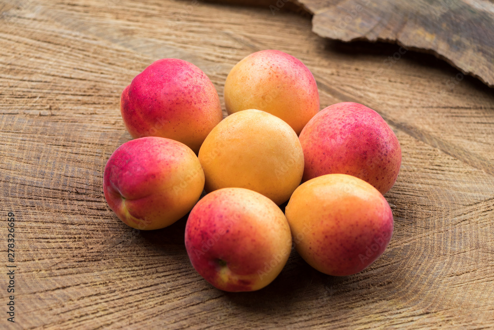 Ripe apricots on stump composed in the form of flower, vega food Ripe apricots on stump composed in the form of flower, vega food