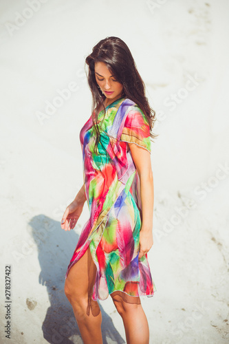 Beautiful woman summer swimwear on the sand 