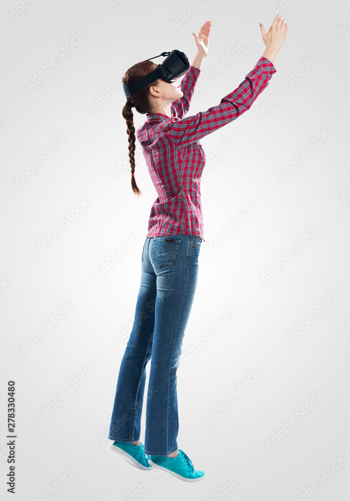 Young woman wearing virtual reality glasses Young woman wearing virtual reality glasses