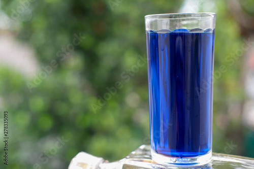 colorful summer drinks and cocktail on blue wood background