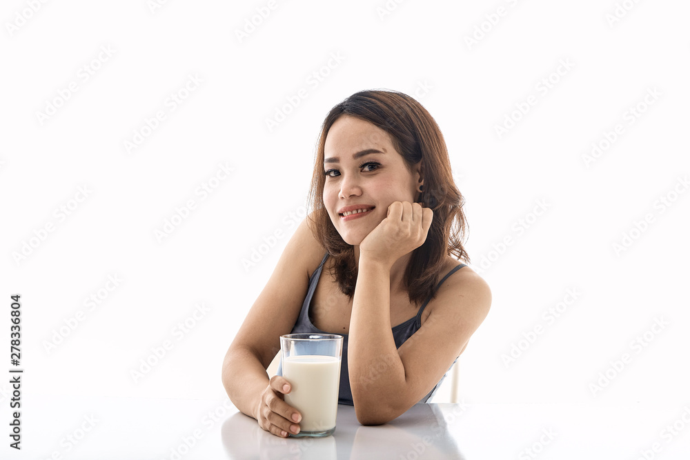 young woman drinking milk on table young woman drinking milk on table