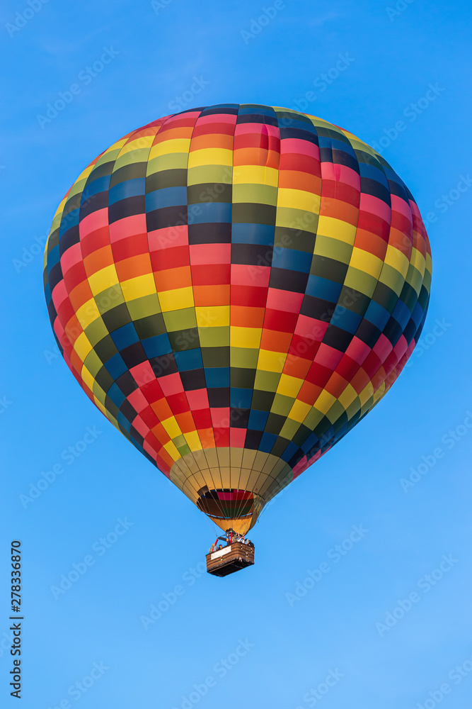 Fototapeta premium A colorful hot air balloon in the sky.