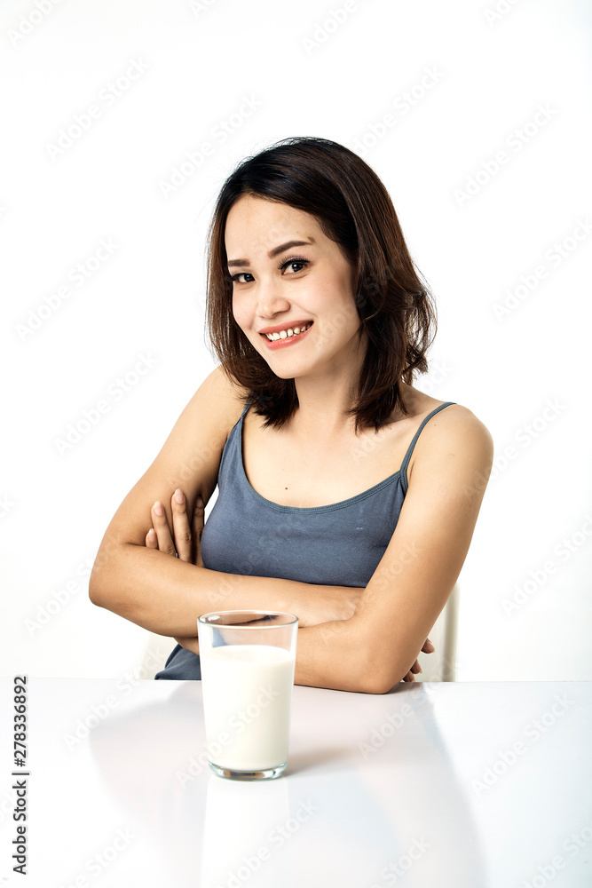 young woman drinking milk on table young woman drinking milk on table